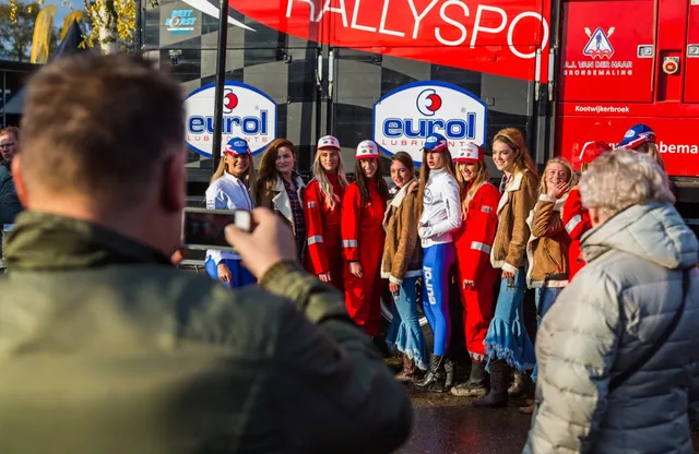 Promotion team being photographed in front of the Eurol rallysport truck at an event